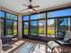 Enclosed Florida room offering serene views and natural light for relaxation and entertainment at 5718 Illumination Ln, Leesburg, FL 34748