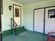 Back porch with steps, storage closet, and welcome mat at 607 Webb Way, The Villages, FL 32159