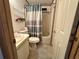 Compact bathroom with shower-tub combination and vanity at 607 Webb Way, The Villages, FL 32159