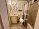 Bathroom featuring a shower with a neutral-toned shower curtain at 607 Webb Way, The Villages, FL 32159