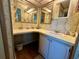 Bathroom featuring wallpaper, white vanity, and plenty of counter space, creating a functional space at 607 Webb Way, The Villages, FL 32159