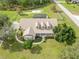 Aerial view of a single Gathering home with screened pool, large yard, and mature trees at 6206 Ocilla Loop, Clermont, FL 34714