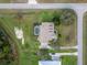 Aerial view of an estate home with swimming pool and green lawn at 6206 Ocilla Loop, Clermont, FL 34714