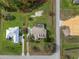 Aerial view of outlined property showing the screened pool and landscaped lot amidst a serene rural environment at 6206 Ocilla Loop, Clermont, FL 34714