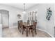 Comfortable dining area featuring a dark wood table and a bright window at 6206 Ocilla Loop, Clermont, FL 34714