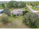 Estate home with a large front yard, mature trees, and a covered front porch at 6206 Ocilla Loop, Clermont, FL 34714