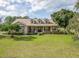 Inviting single Gathering home with a manicured lawn, dormer windows, and a charming front porch at 6206 Ocilla Loop, Clermont, FL 34714