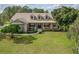 Charming single Gathering home featuring a manicured lawn, dormer windows, and inviting front porch at 6206 Ocilla Loop, Clermont, FL 34714