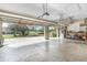 Spacious garage with two bays, concrete floor and view of the grounds outside at 6206 Ocilla Loop, Clermont, FL 34714