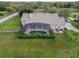 Aerial view showing a screened pool, perfect for outdoor relaxation and entertaining in a private setting at 6206 Ocilla Loop, Clermont, FL 34714