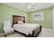 Calming bedroom with a bed and chair, featuring tile floors and a window at 7036 Clarcona Ocoee Dr, Orlando, FL 32818