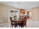 Dining area that features tile floors, adjacent to the kitchen, and a sliding glass door to the exterior at 7036 Clarcona Ocoee Dr, Orlando, FL 32818