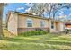 Charming home exterior with brick accents and manicured lawn at 7036 Clarcona Ocoee Dr, Orlando, FL 32818