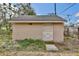 Shed with cross-buck door offers additional storage space; surrounded by vegetation at 7036 Clarcona Ocoee Dr, Orlando, FL 32818