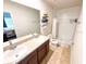 Bathroom featuring double sinks, granite countertops, and tile flooring at 726 Eagle Landing Blvd, Winter Haven, FL 33880