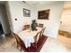 Bright dining area features a table with seating for six and an elegant centerpiece at 726 Eagle Landing Blvd, Winter Haven, FL 33880