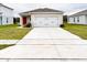 View of the house exterior, showing the garage and driveway at 726 Eagle Landing Blvd, Winter Haven, FL 33880