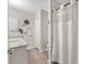 Bathroom featuring double sinks, granite countertops, white cabinets, and modern fixtures at 8425 Se 177Th Bartram Loop, The Villages, FL 32162