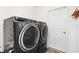 Modern laundry room featuring front-load washer and dryer and white walls at 8425 Se 177Th Bartram Loop, The Villages, FL 32162