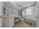 Well-lit bathroom featuring vanity, toilet, shower and bathtub with bright lighting at 906 Calabria Ave, Davenport, FL 33897