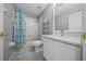 Cozy bathroom featuring a shower-tub combo with a blue patterned curtain and white vanity at 906 Calabria Ave, Davenport, FL 33897