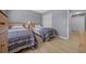 Bedroom featuring two twin beds, wooden furniture, and a closet at 906 Calabria Ave, Davenport, FL 33897