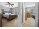 Comfortable bedroom with wood floors and a view into the adjacent room, creating a warm atmosphere at 906 Calabria Ave, Davenport, FL 33897