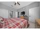 This bedroom features tile floors, two closets, and a ceiling fan for comfort at 906 Calabria Ave, Davenport, FL 33897