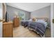 Bedroom featuring two twin beds, wooden furniture, and a window with natural light at 906 Calabria Ave, Davenport, FL 33897