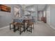 Dining area with a modern table setup, stylish lighting, and a view into the kitchen at 906 Calabria Ave, Davenport, FL 33897