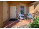 Cozy front porch with chairs, perfect for enjoying a morning coffee or evening relaxation at 906 Calabria Ave, Davenport, FL 33897