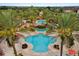 Resort-style pool area surrounded by palm trees, lounge chairs, and lush landscaping at 906 Calabria Ave, Davenport, FL 33897