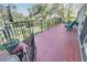 Spacious back deck with a metal railing, ideal for enjoying the outdoors at 925 Northside Dr, Mount Dora, FL 32757