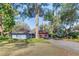 Charming single-story home with lush landscaping and a driveway at 925 Northside Dr, Mount Dora, FL 32757