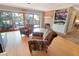 Cozy living room featuring large sliding doors to a deck, wood floors, fireplace and built-in shelves at 925 Northside Dr, Mount Dora, FL 32757