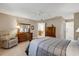 Bedroom features neutral walls, tile flooring, plenty of furniture and good natural light at 9511 Se 168Th Elderberry Pl, The Villages, FL 32162