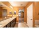 Bathroom featuring double vanities and granite countertops at 1041 Bradford Ridge Dr, Leesburg, FL 34748