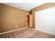 Bedroom featuring neutral carpet, neutral walls, and a closet at 1041 Bradford Ridge Dr, Leesburg, FL 34748