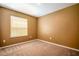 A carpeted bedroom with a window at 1041 Bradford Ridge Dr, Leesburg, FL 34748