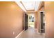 View of the foyer leading to the rest of the house, with tile flooring and a neutral color scheme at 1041 Bradford Ridge Dr, Leesburg, FL 34748