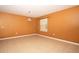 Living room area featuring neutral tile flooring and a decorative light fixture at 1041 Bradford Ridge Dr, Leesburg, FL 34748