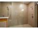 Bathroom shower featuring neutral toned tiles and a glass enclosure at 1041 Bradford Ridge Dr, Leesburg, FL 34748