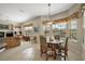 Inviting dining area bathed in natural light from large windows, perfect for intimate meals at 1075 Ceasars Ct, Mount Dora, FL 32757