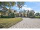 Inviting home with stone accents, paver driveway, and well-manicured lawn at 1075 Ceasars Ct, Mount Dora, FL 32757