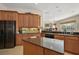 Well-equipped kitchen featuring granite countertops, center island, and breakfast bar at 1075 Ceasars Ct, Mount Dora, FL 32757