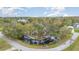 Gorgeous aerial view of the home and surrounding nature, along with a private dock on the canal at 11415 Palmetto Dr, Tavares, FL 32778