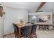 Dining area featuring a marble-top table and leather chairs next to the kitchen at 11415 Palmetto Dr, Tavares, FL 32778