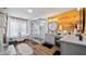 Bright bathroom featuring a soaking tub, glass-enclosed shower, and dual vanities with modern lighting at 12117 Cypress Ln, Clermont, FL 34711