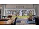 Bright dining area with sliding glass doors leading to a deck and lake view beyond at 12117 Cypress Ln, Clermont, FL 34711