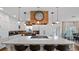 Spacious kitchen with a large island, seating, stylish pendants, and lake view at 12117 Cypress Ln, Clermont, FL 34711